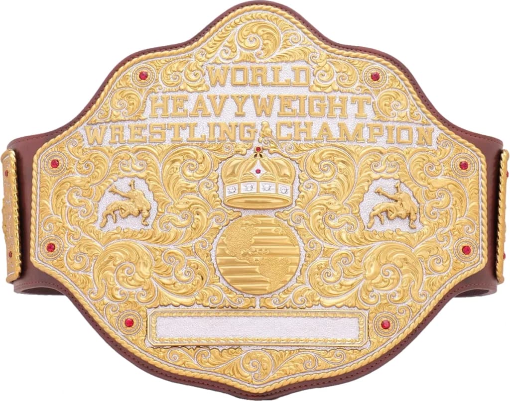 Display-grade replica championship title belt with die-struck metal plates on a full-grain leather strap.