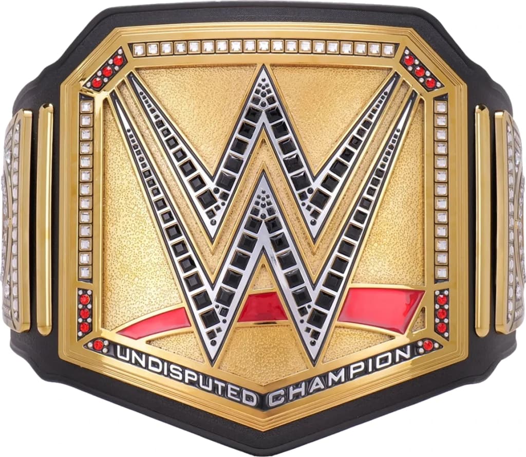 Display-grade replica championship title belt with die-struck metal plates on a full-grain leather strap.