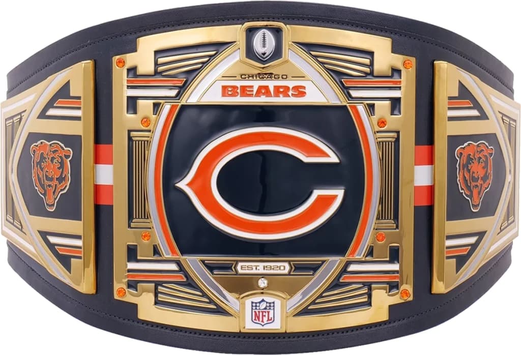 Display-grade replica championship title belt with die-struck metal plates on a full-grain leather strap.