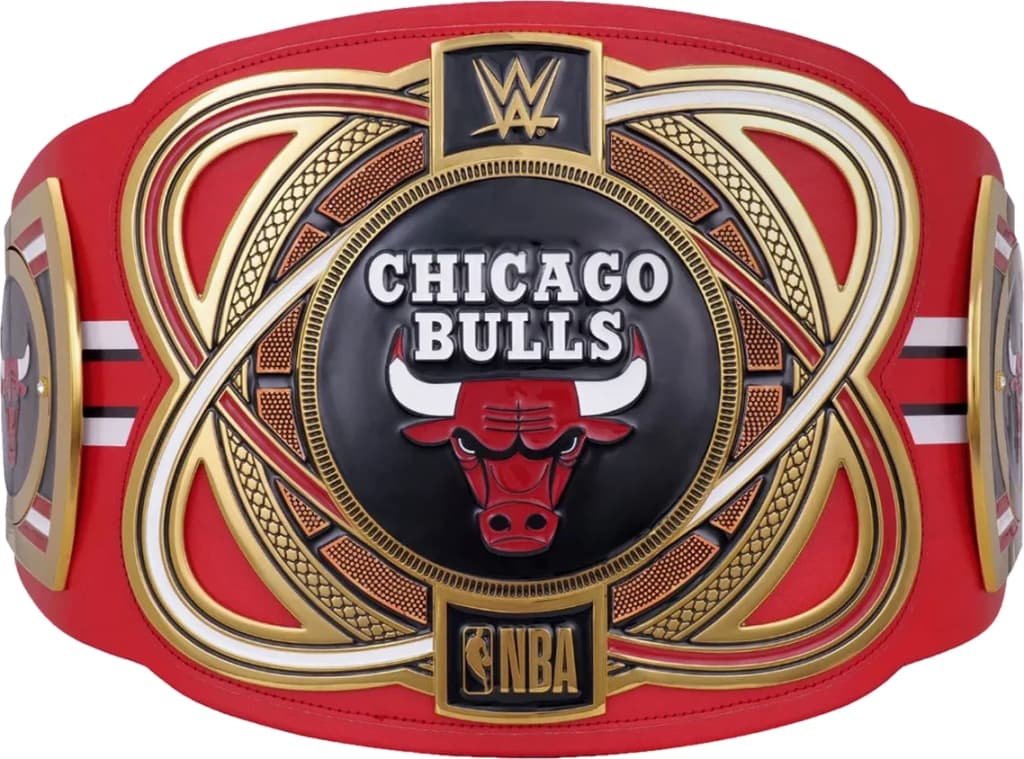 Display-grade replica championship title belt with die-struck metal plates on a full-grain leather strap.
