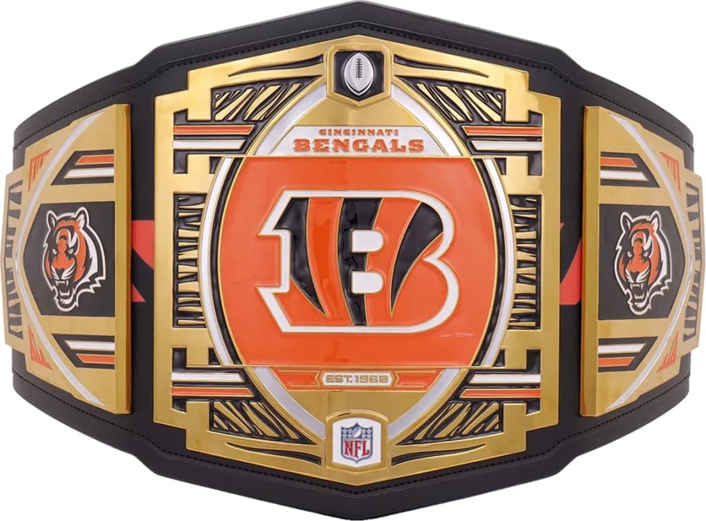 Display-grade replica championship title belt with die-struck metal plates on a full-grain leather strap.
