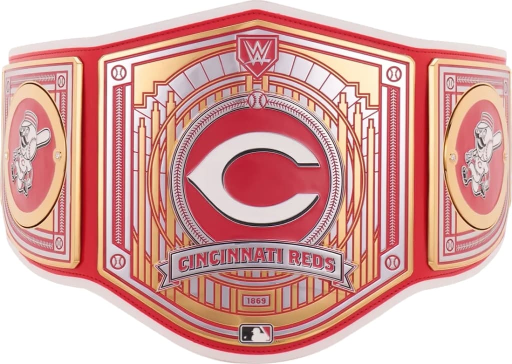 Display-grade replica championship title belt with die-struck metal plates on a full-grain leather strap.