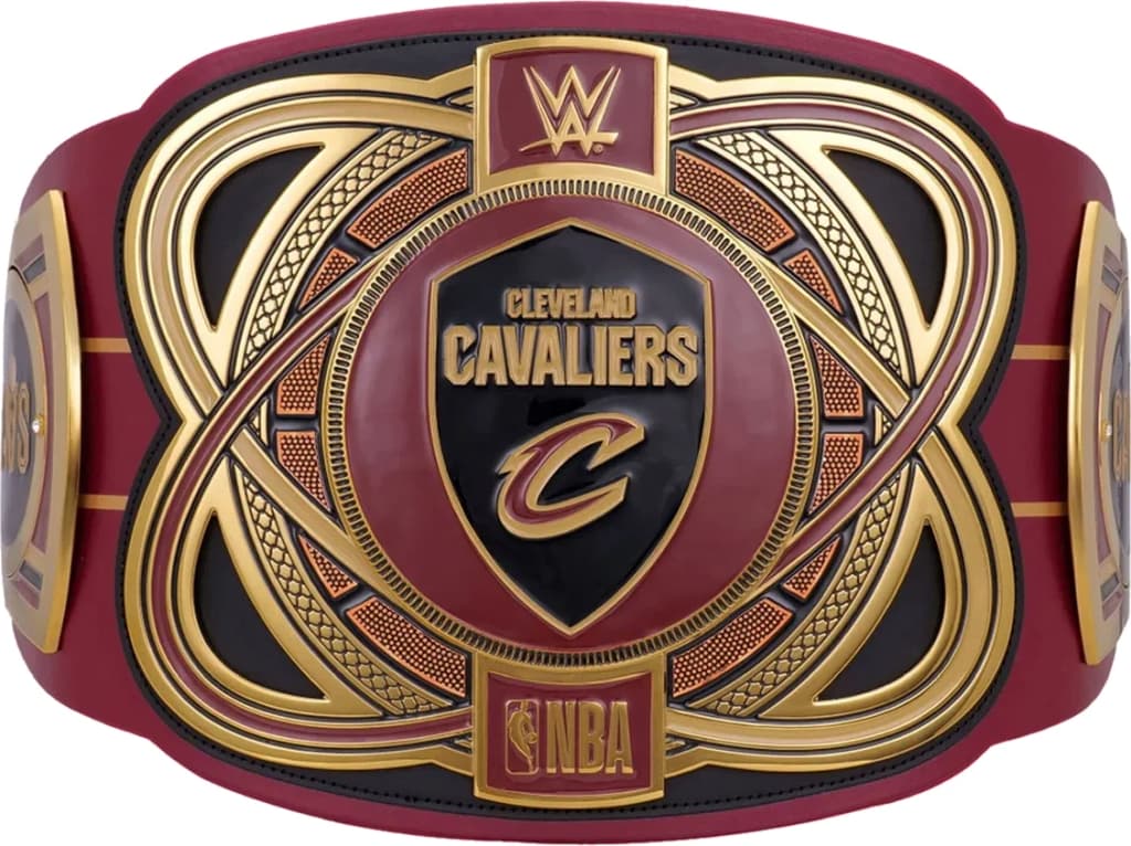 Display-grade replica championship title belt with die-struck metal plates on a full-grain leather strap.