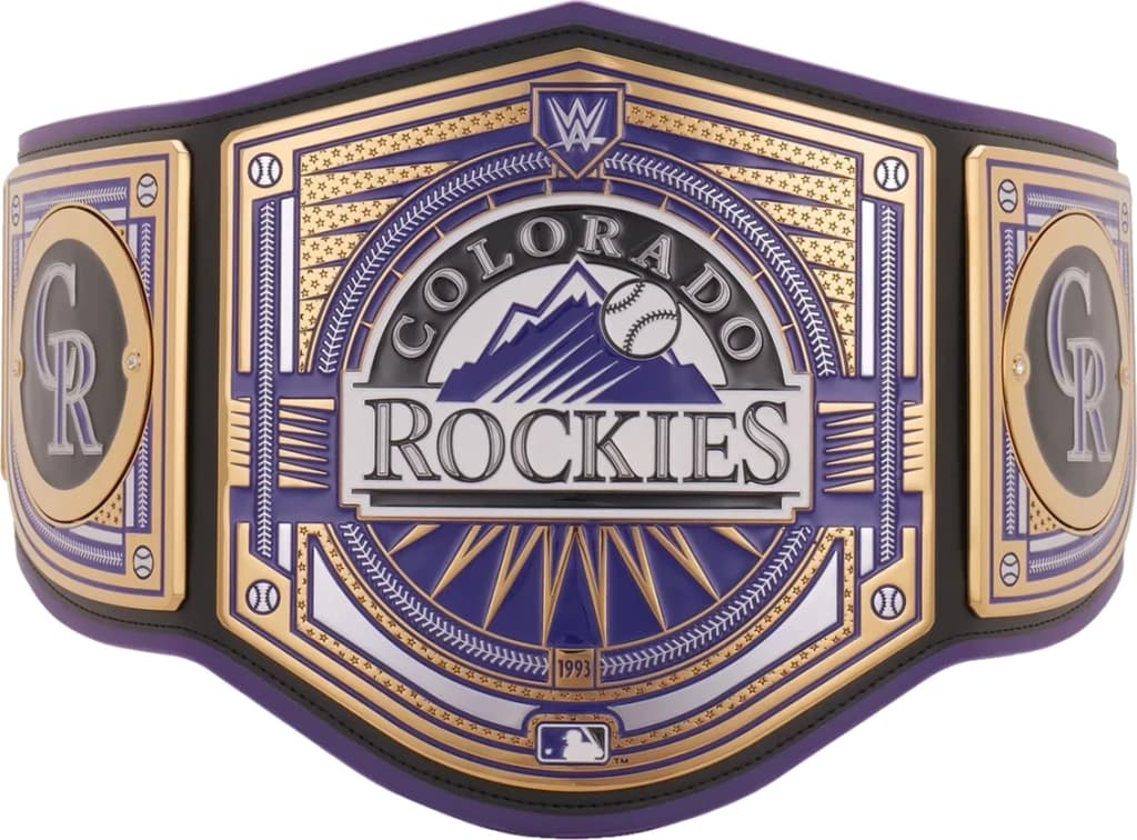 Display-grade replica championship title belt with die-struck metal plates on a full-grain leather strap.