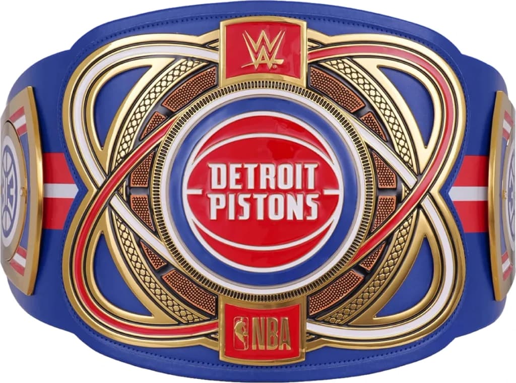 Display-grade replica championship title belt with die-struck metal plates on a full-grain leather strap.
