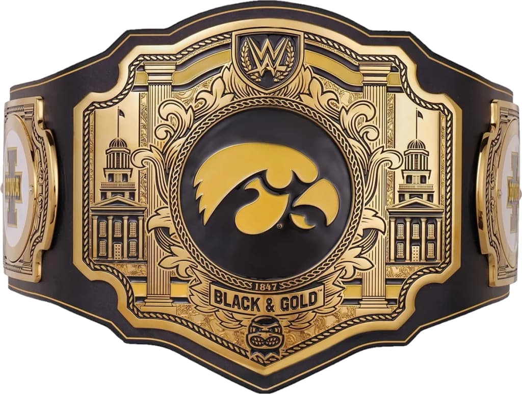 Display-grade replica championship title belt with die-struck metal plates on a full-grain leather strap.