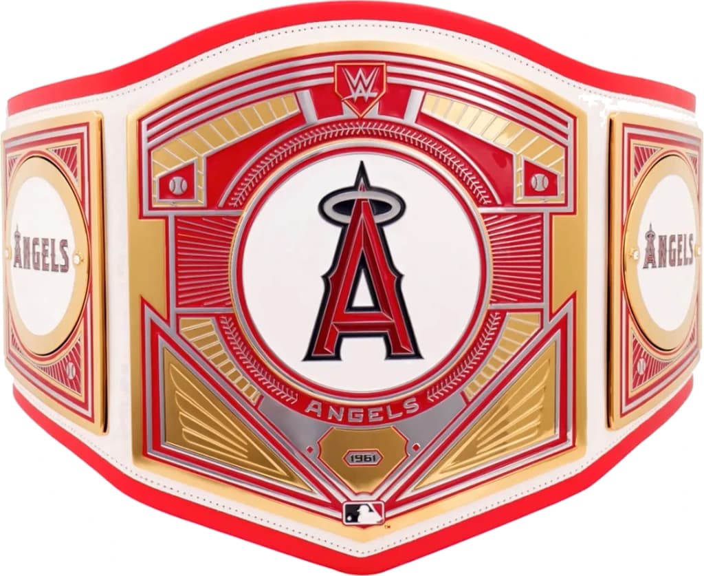 Display-grade replica championship title belt with die-struck metal plates on a full-grain leather strap.