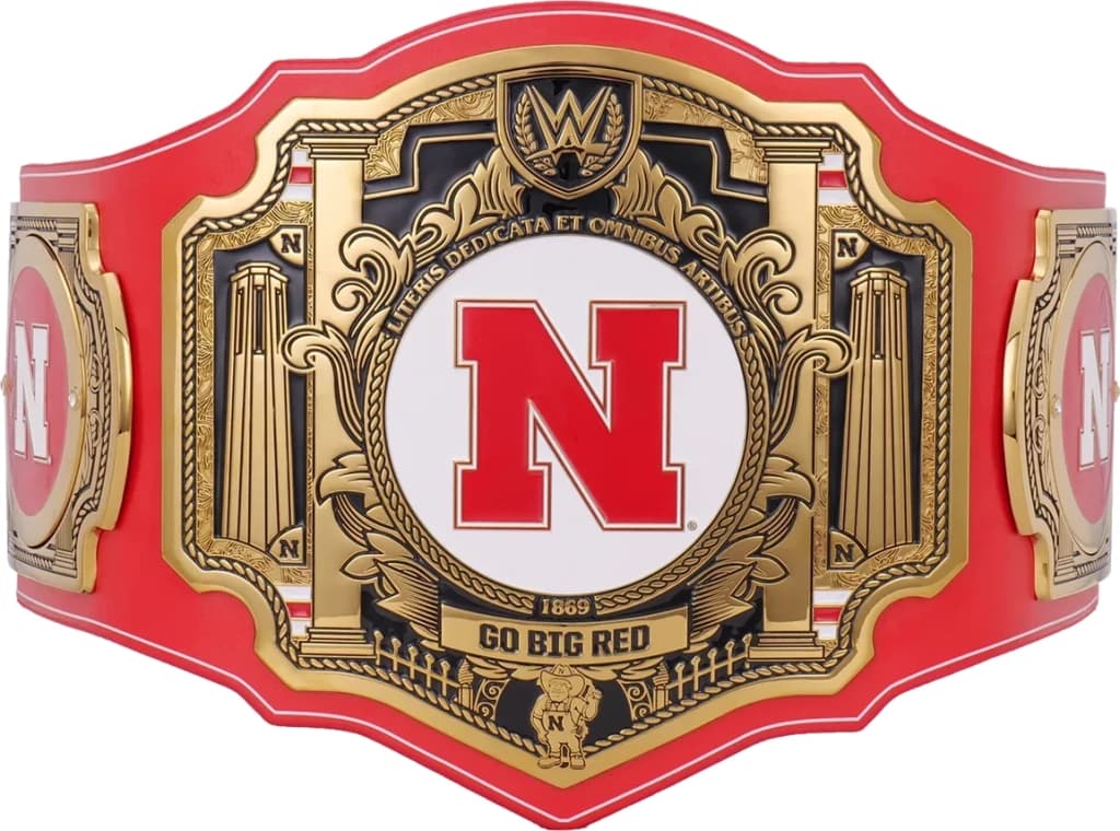 Display-grade replica championship title belt with die-struck metal plates on a full-grain leather strap.