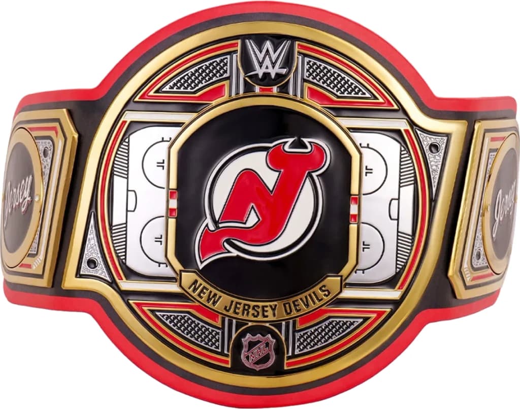 Display-grade replica championship title belt with die-struck metal plates on a full-grain leather strap.