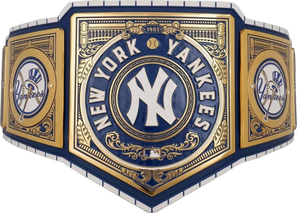 Display-grade replica championship title belt with die-struck metal plates on a full-grain leather strap.