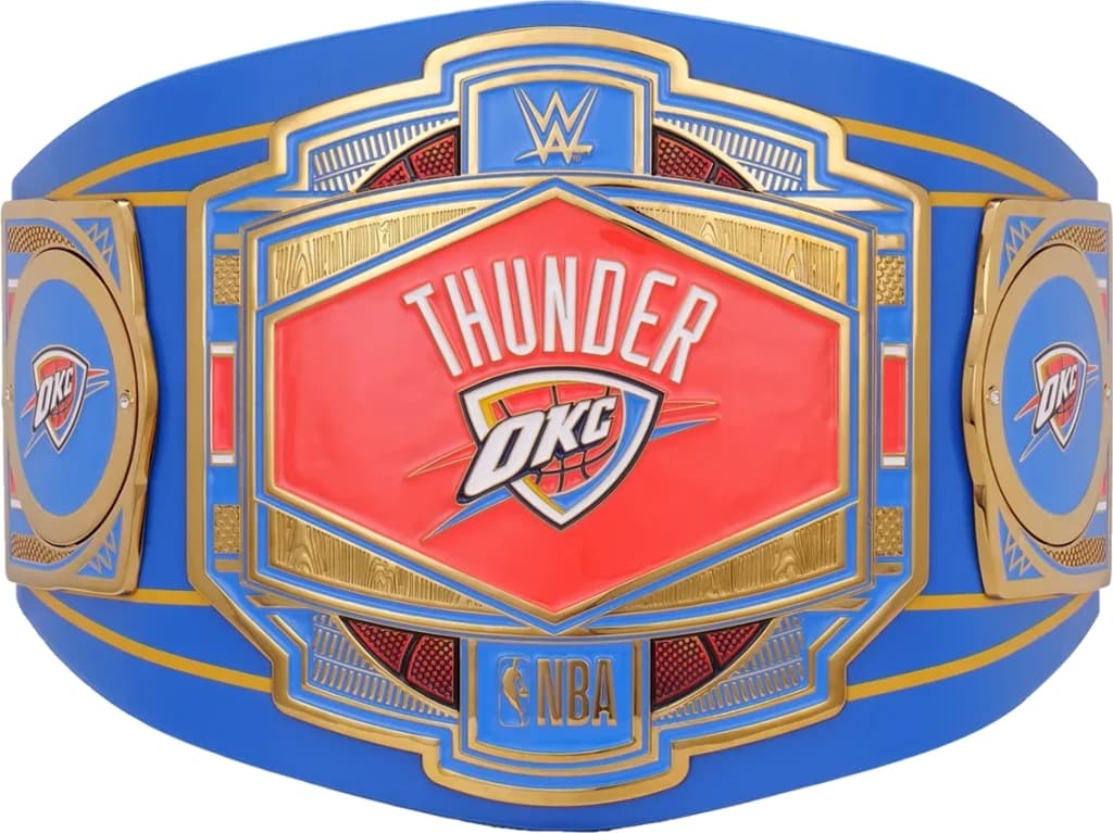 Display-grade replica championship title belt with die-struck metal plates on a full-grain leather strap.