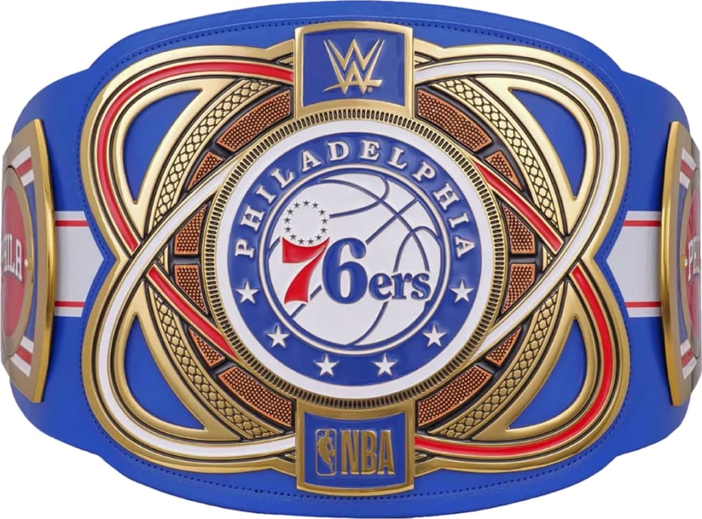 Display-grade replica championship title belt with die-struck metal plates on a full-grain leather strap.