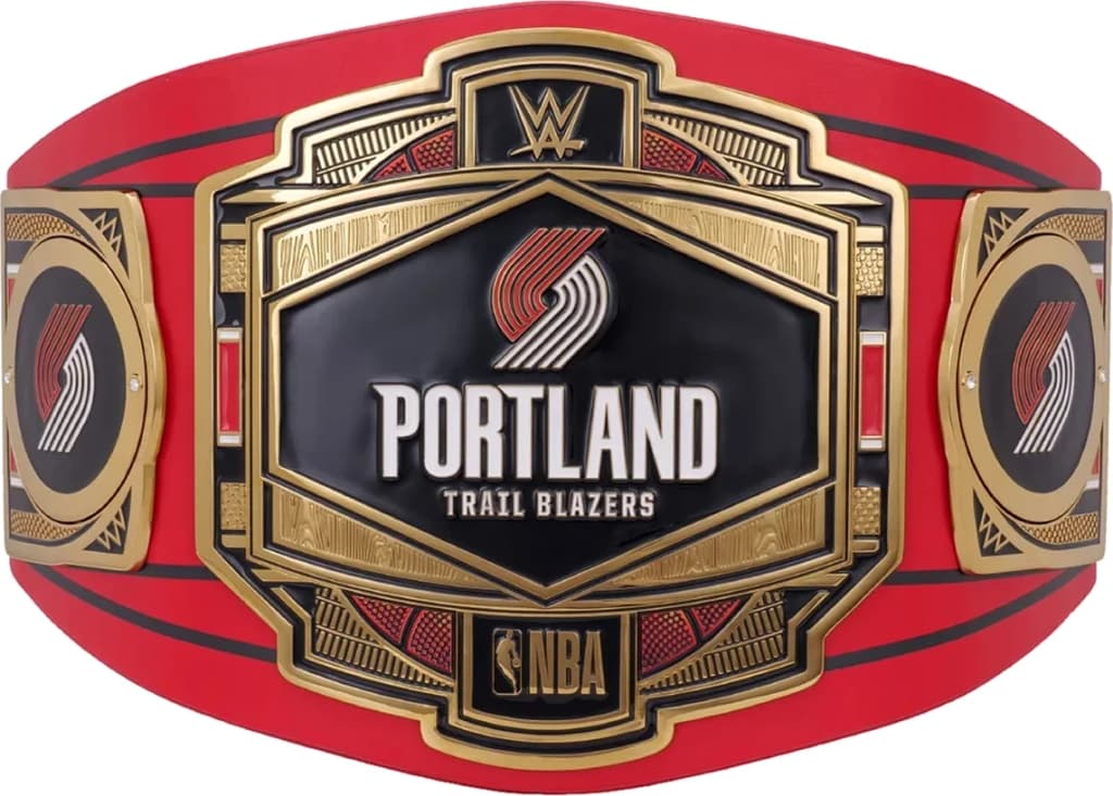 Display-grade replica championship title belt with die-struck metal plates on a full-grain leather strap.
