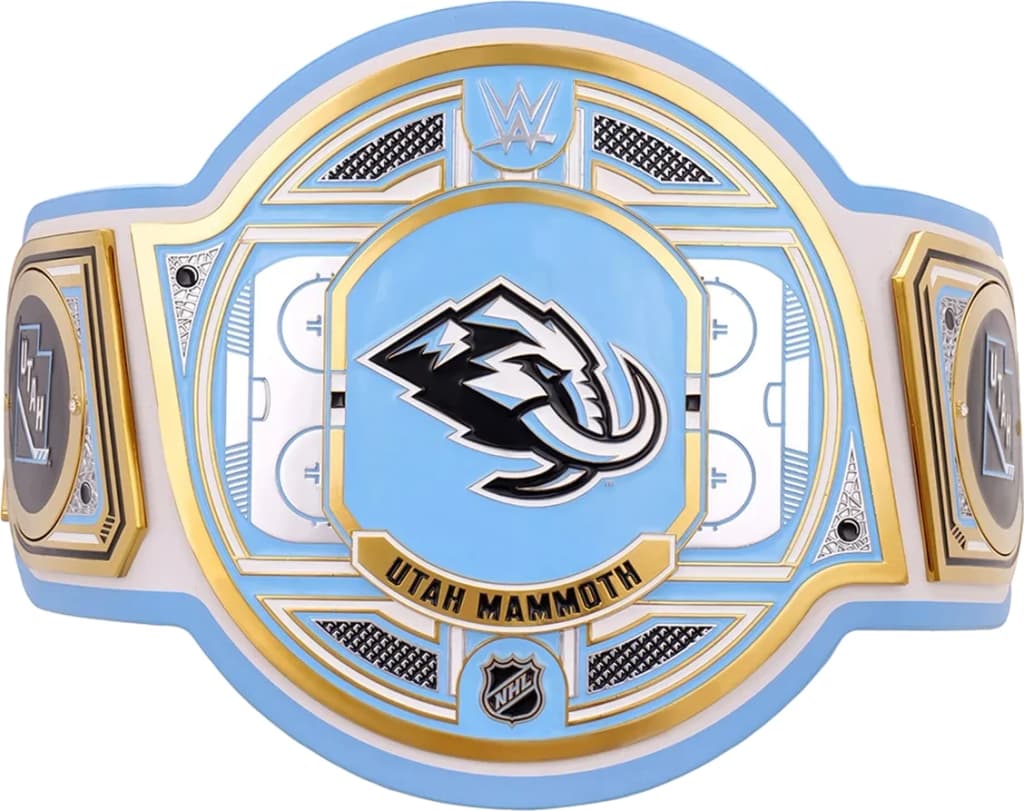 Display-grade replica championship title belt with die-struck metal plates on a full-grain leather strap.